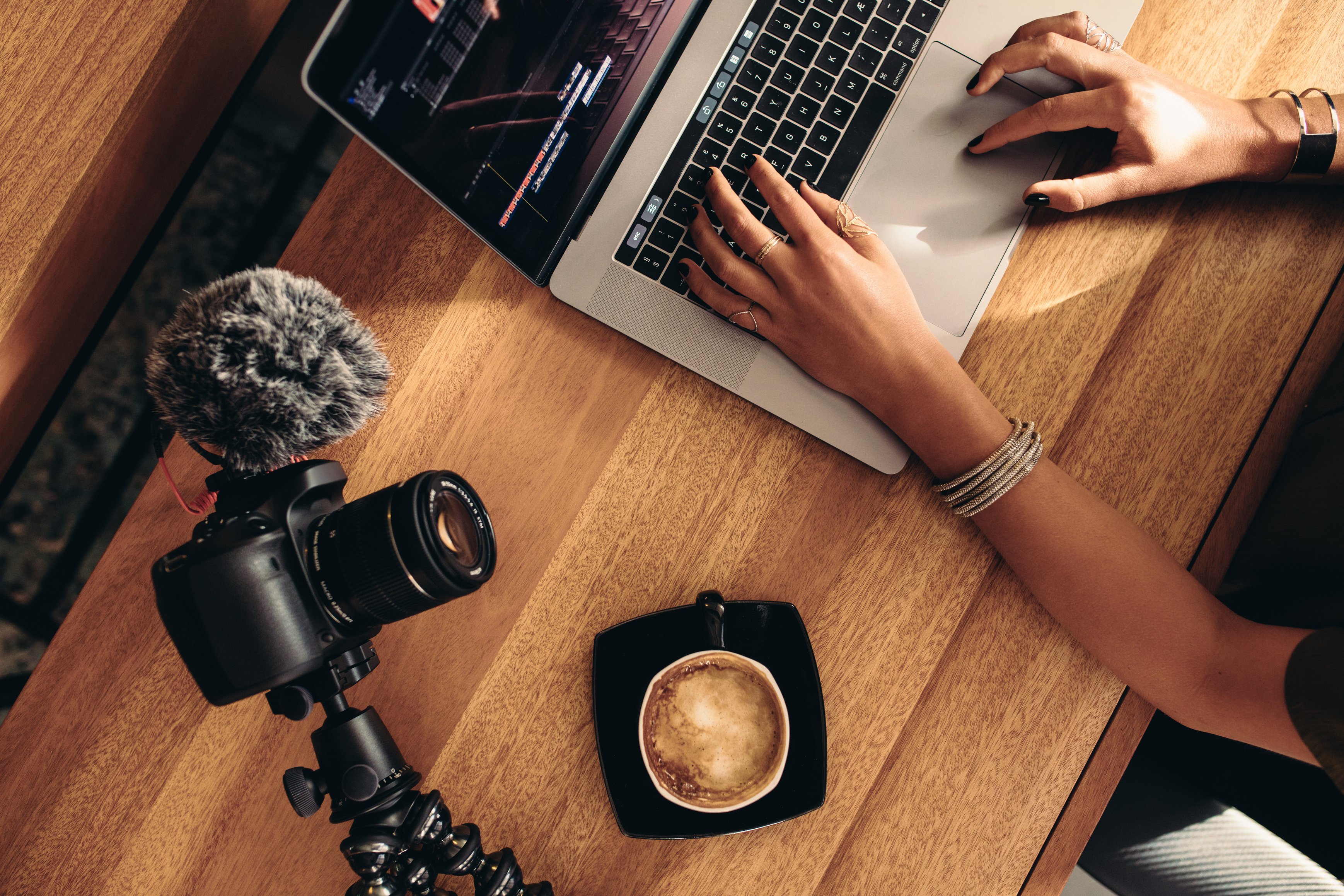 Young Female Vlogger Editing Her Vlog on Computer